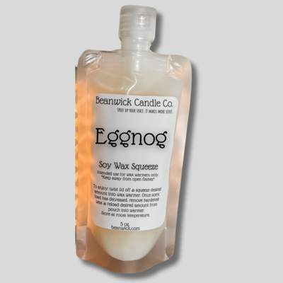 a bottle of eggnog soap sitting in a package