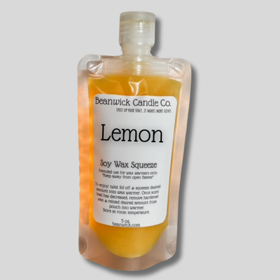 a bottle of lemon soap on a gray background