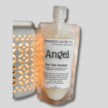 Load image into Gallery viewer, a bottle of angel soap next to a container of soap