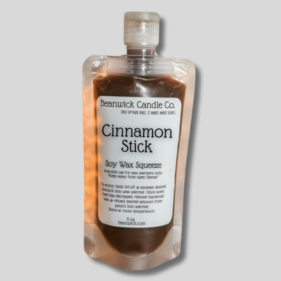 a bottle of cinnamon stick sitting on top of a table