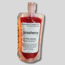 Load image into Gallery viewer, a bottle of strawberry syrup sitting on top of a table