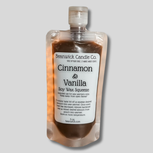 a bottle of cinnamon and vanilla body wax