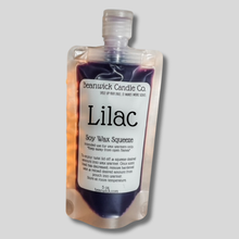 Load image into Gallery viewer, a bottle of lilac on a gray background