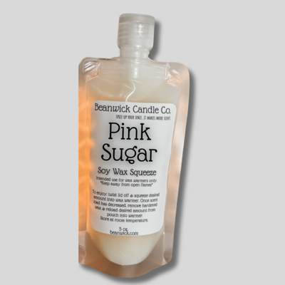 a bottle of pink sugar on a gray background