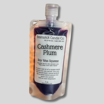 a bottle of cashmere plum soap on a gray background