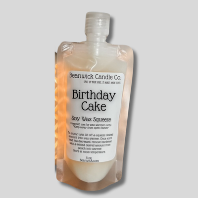 a bottle of birthday cake soap in a package