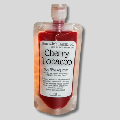 a bottle of cherry tobacco sitting on a table