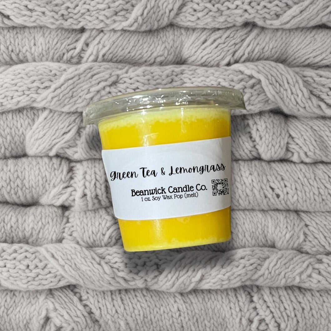 a jar of lemongrass sits on a pile of blankets