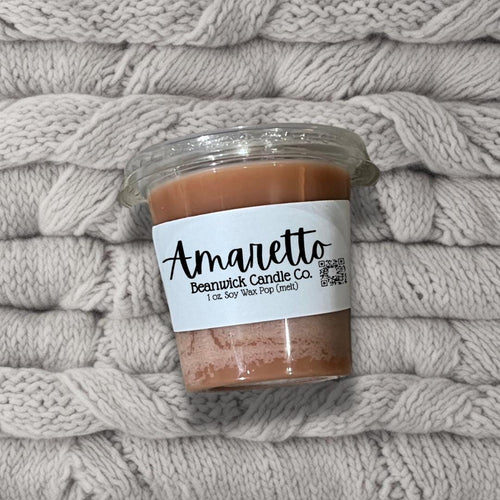 a jar of food sitting on top of a pile of blankets