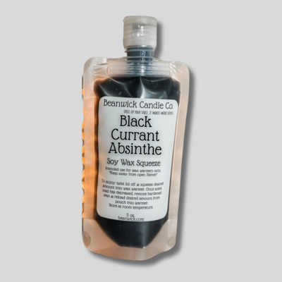 a bottle of black currant absinte