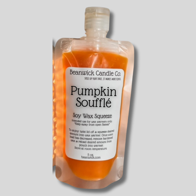 a bottle of pumpkin souffle on a gray background