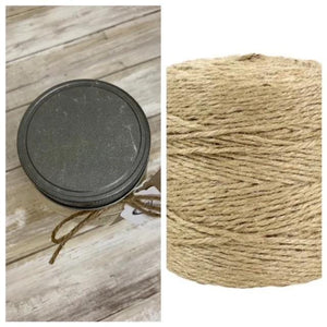 a spool of twine next to a spool of twine