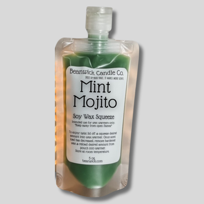 a bottle of mint mojitto on a gray background