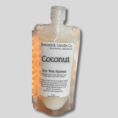 a bottle of coconut body wash sitting in a package