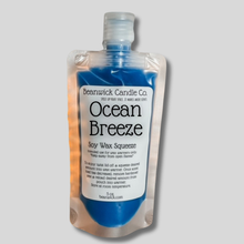 Load image into Gallery viewer, a bottle of ocean breeze on a gray background