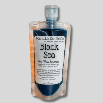 a bottle of black sea soap on a gray background