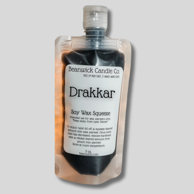 a bottle of drakkarr on a gray background