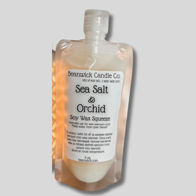 a bottle of sea salt and orchid body wash