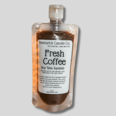 a bottle of fresh coffee on a gray background