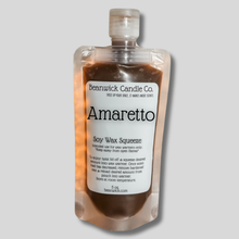 Load image into Gallery viewer, a bottle of amretto on a gray background