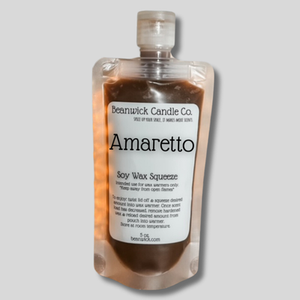 a bottle of amretto on a gray background